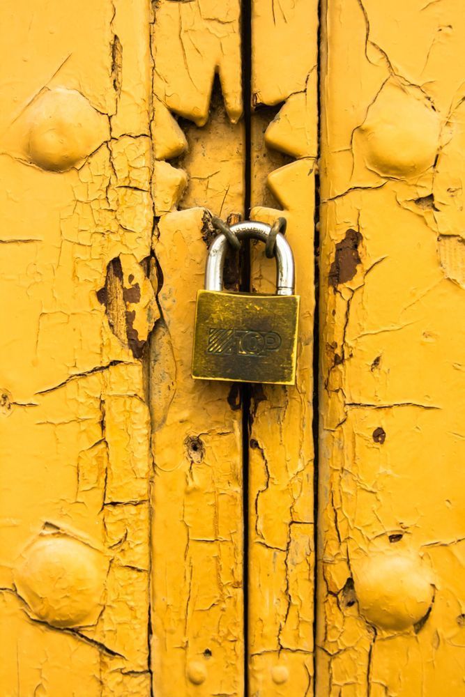 Locked in Time - Rustic wall art featuring aged wood and metal lock