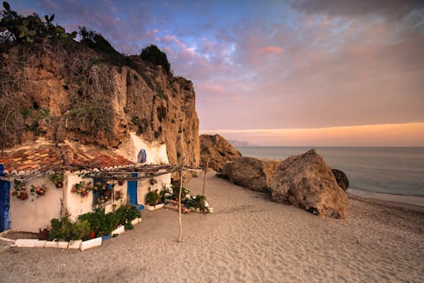 Life at the Edge of the Sea - Andalusian beach scene with warm light and rustic charm