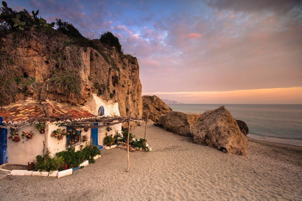 Life at the Edge of the Sea - Andalusian beach scene with warm light and rustic charm