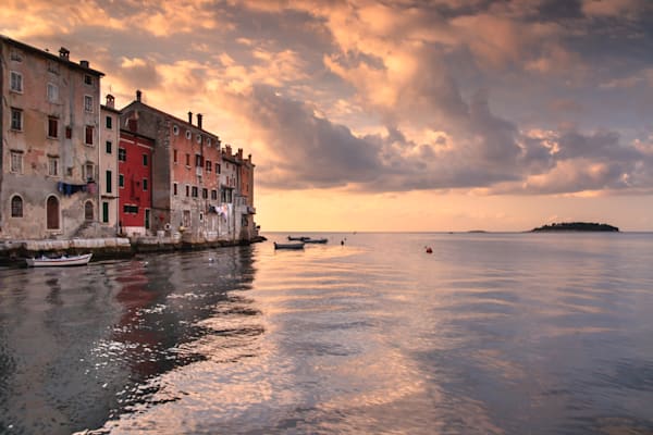 Where the Sea Meets the Town - Mediterranean townscape with colorful buildings reflected in calm sea - Rovinij, Croatia