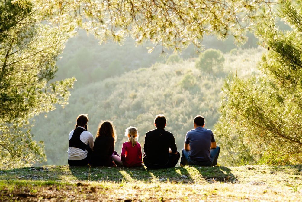 Under the Andalusian Sun - Friends sitting under a tree in the Andalusian mountains