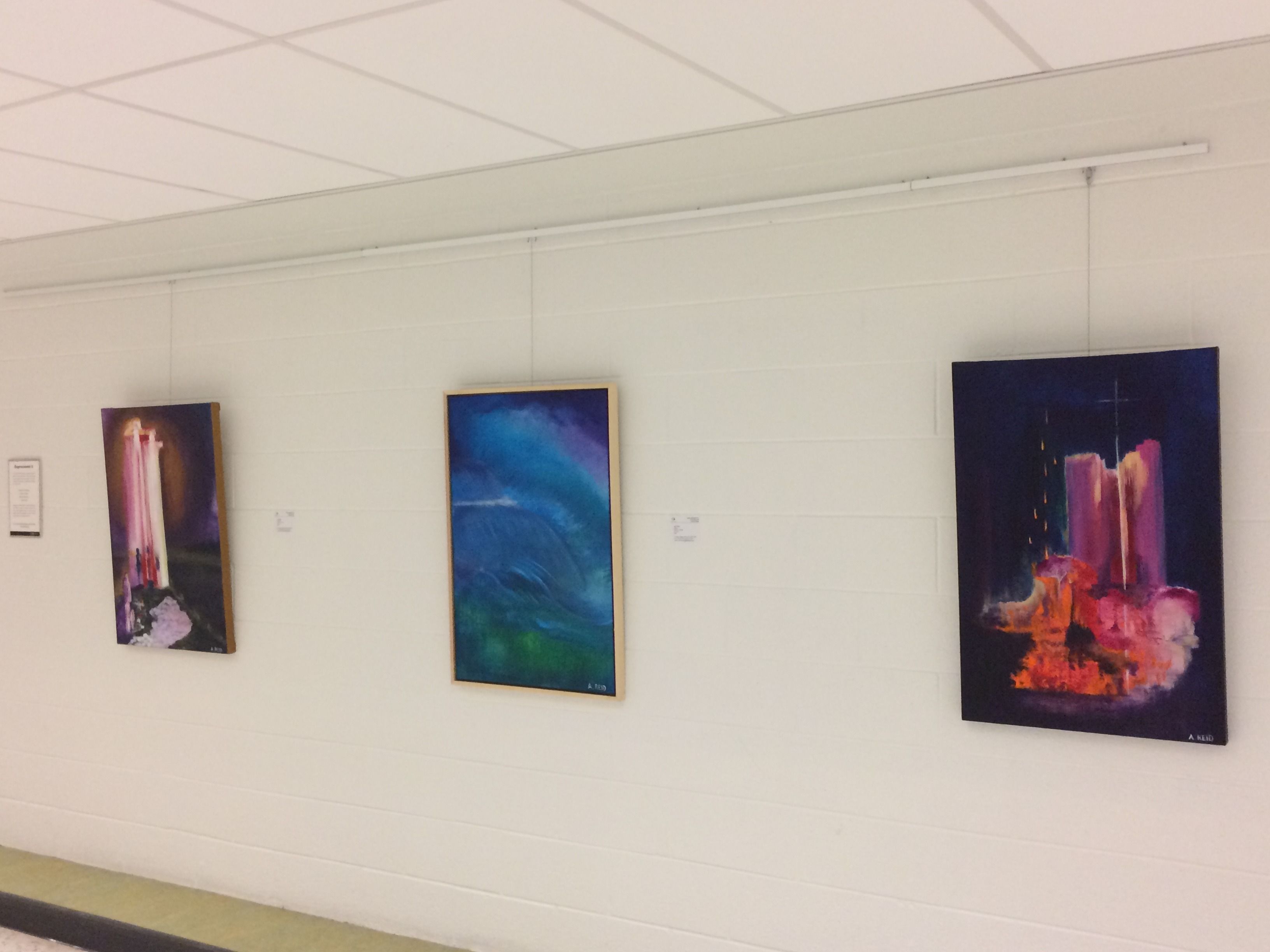 Installation view of Golgotha, Deluge, and Seed of the Woman original paintings by Anne Reid Artist at QEPCC Oakville