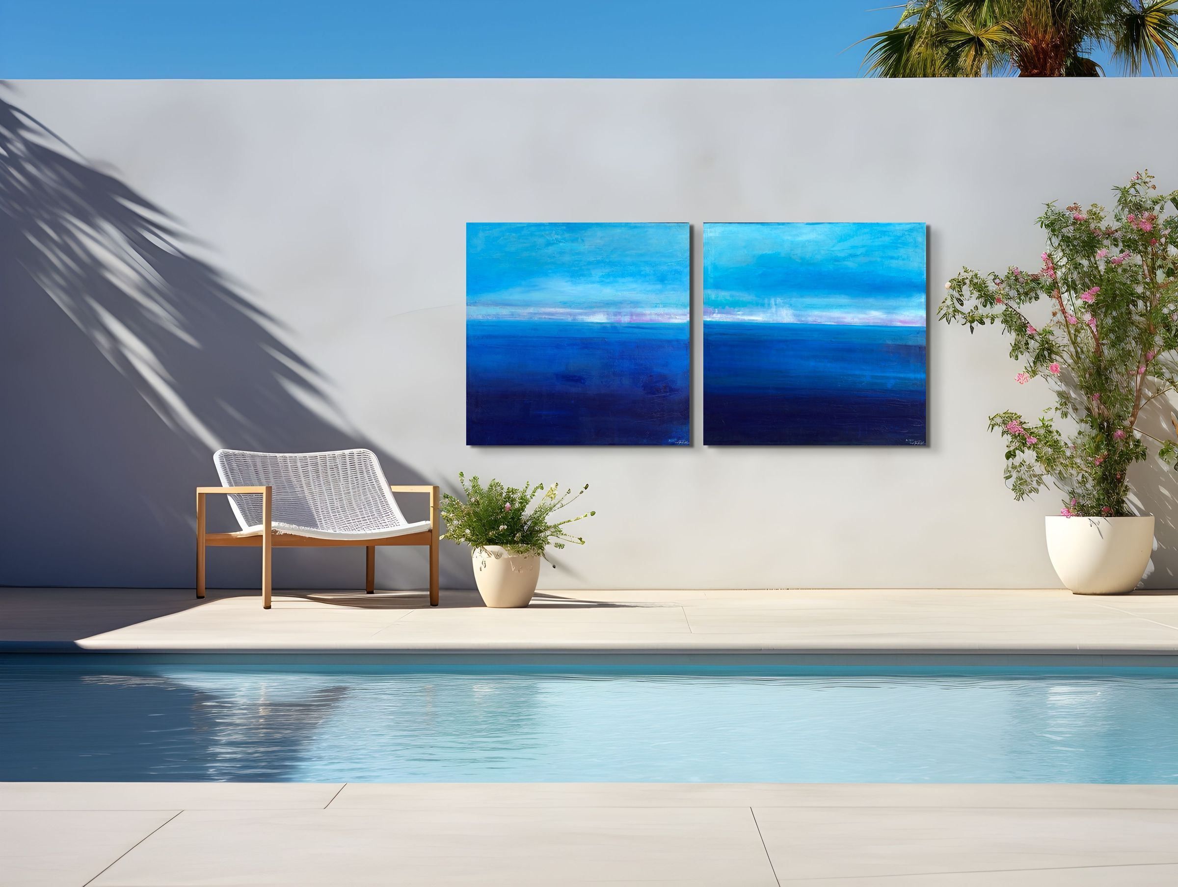 Serenity 11 and Serenity 10, metal prints by Anne Reid Artist, shown as a diptych on an outdoor wall beside a pool.