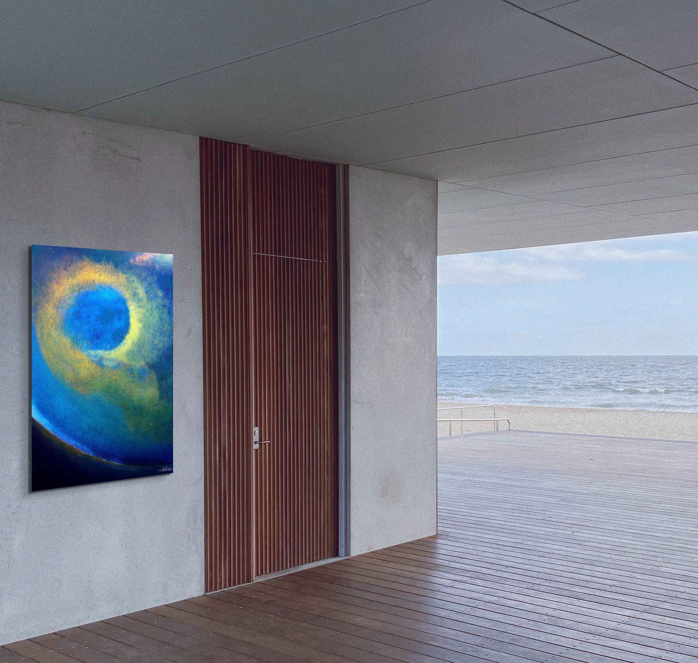 Glory Storm 4, fine art print by Anne Reid Artist shown on a pale concrete wall beside a timber door in a coastal property setting with ocean views.