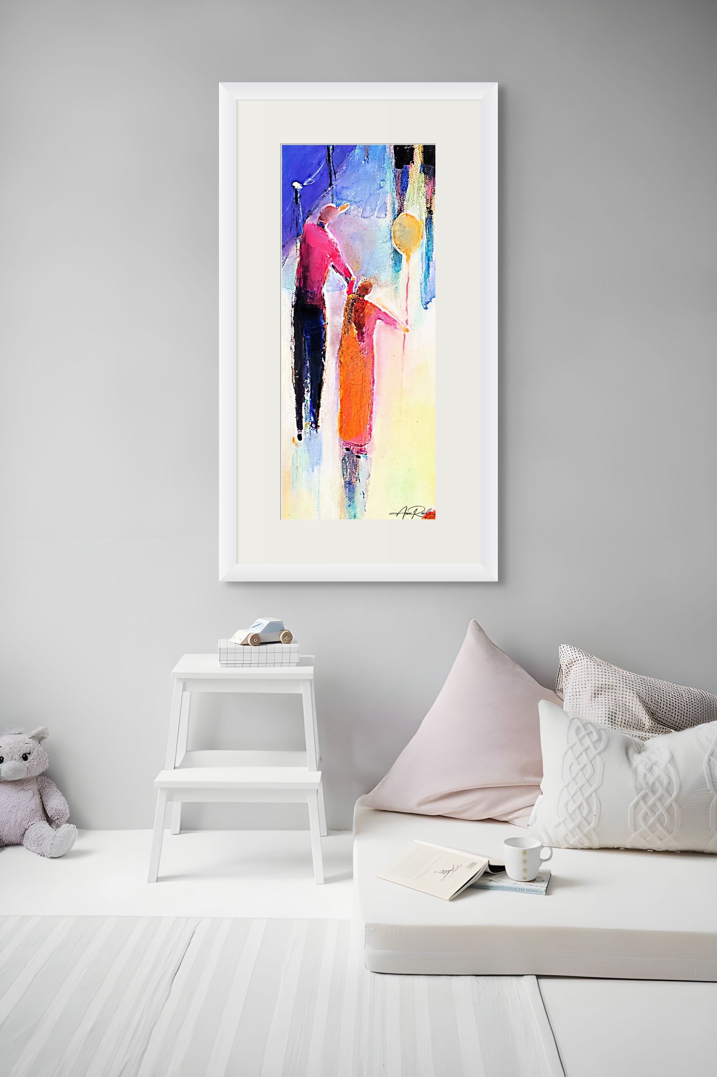 Father & Daughter with a Balloon, print by Anne Reid Artist shown framed with a white mat above a daybed in a child's room.