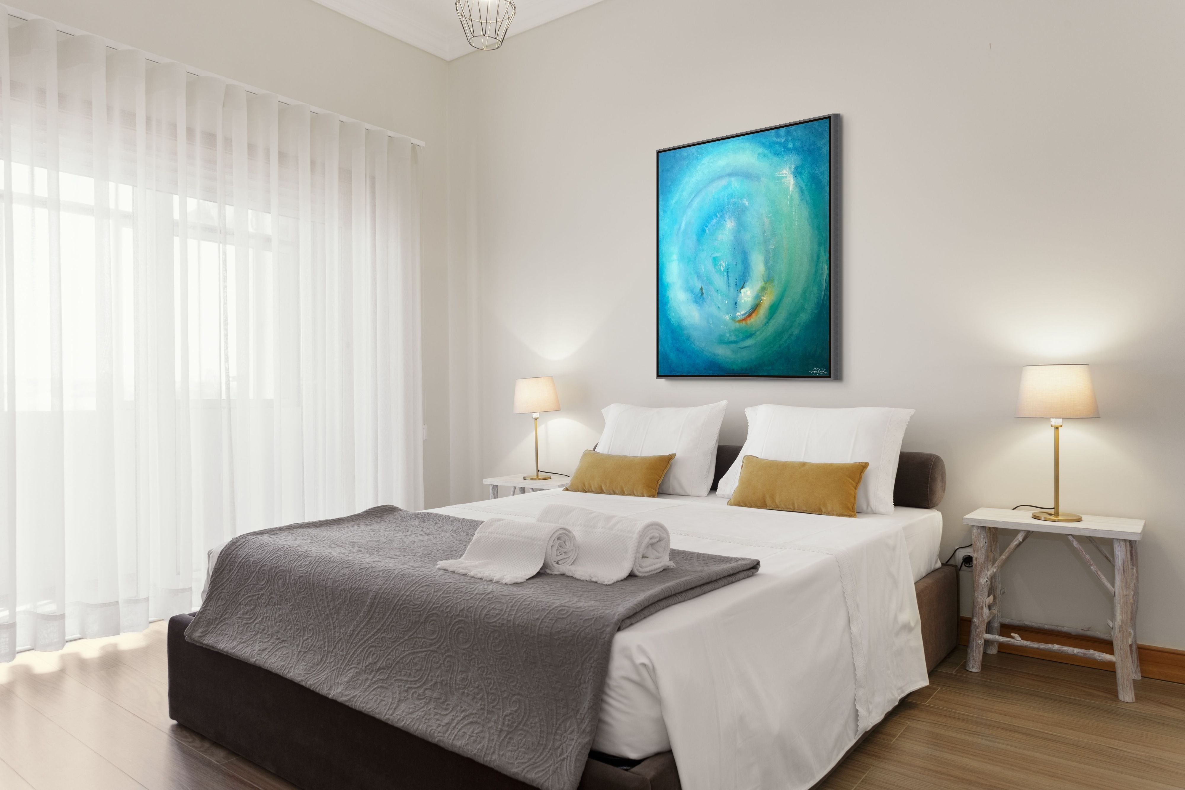 Advent 7 open edition fine art print by Anne Reid Artist — turquoise and teal spiral with warm amber ember, shown above a bed in a contemporary hotel bedroom with white linens and gold accent pillows.