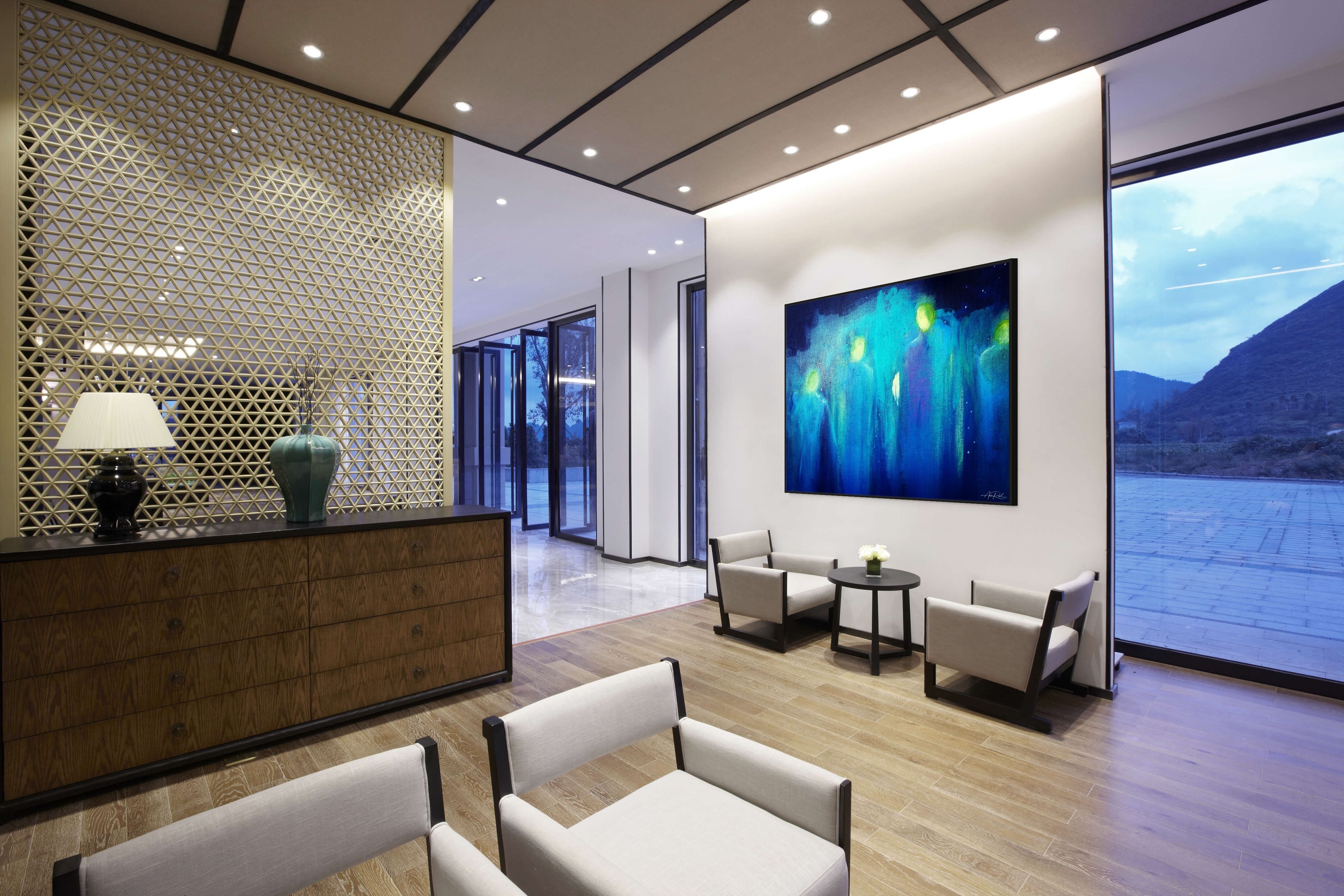 Angels 5 open edition print by Anne Reid Artist — veil-like luminous figures in indigo and turquoise with golden halos, styled in a modern interior.