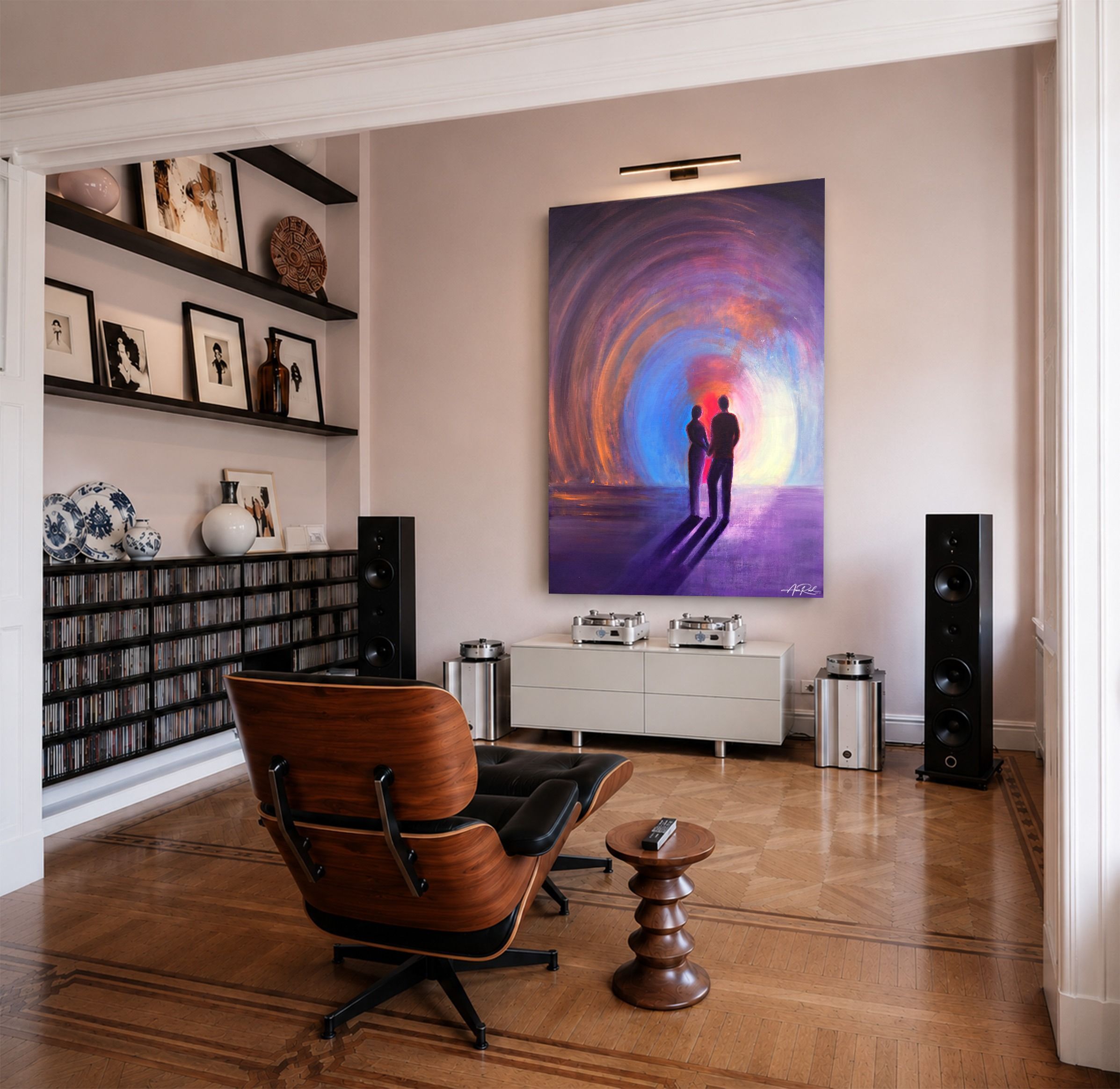 Two, metal wall art by Anne Reid Artist shown on the back wall in a listening room setting.