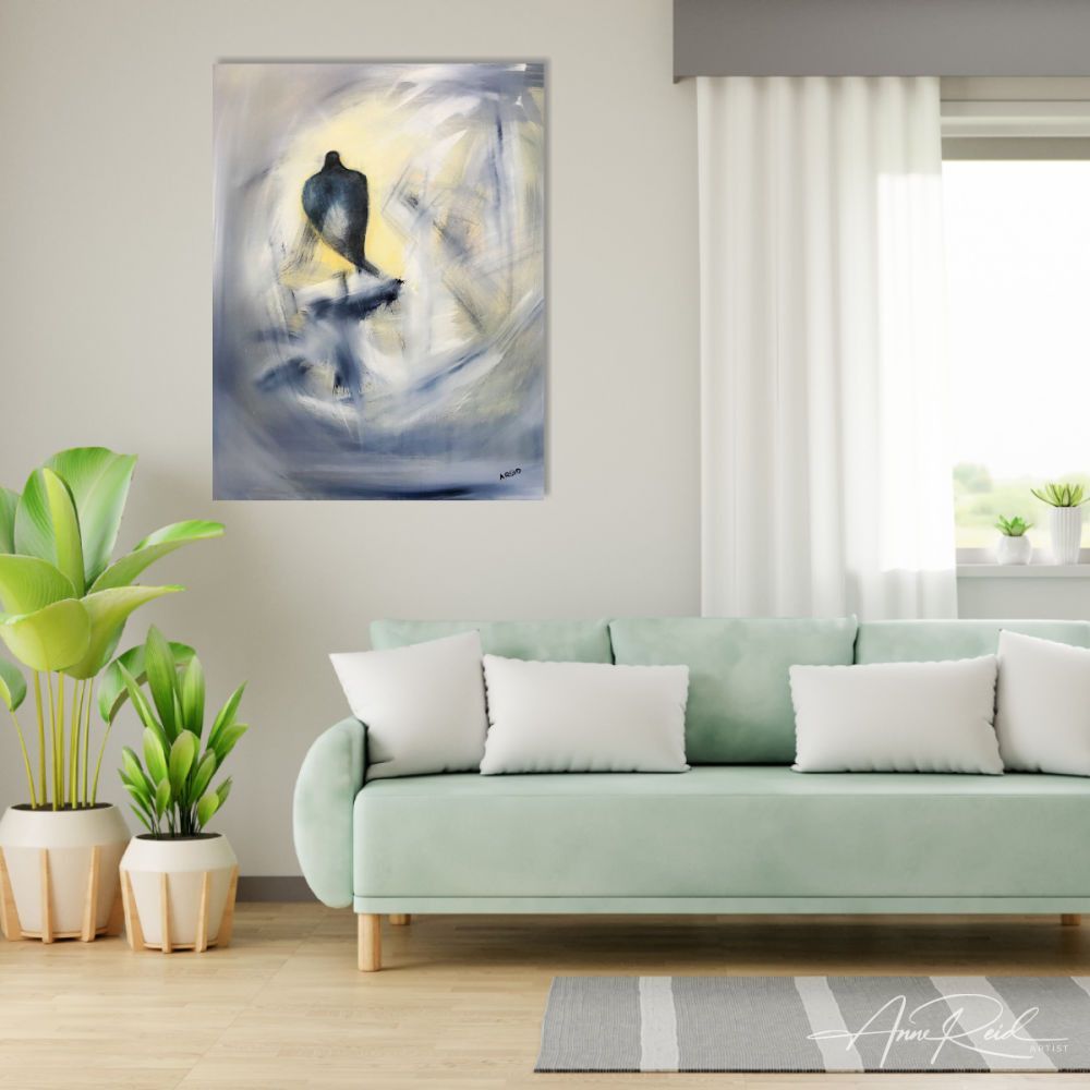 Watchman 2 fine art print by Anne Reid Artist shown above a pale mint-green sofa in a bright living room with white cushions and potted plants