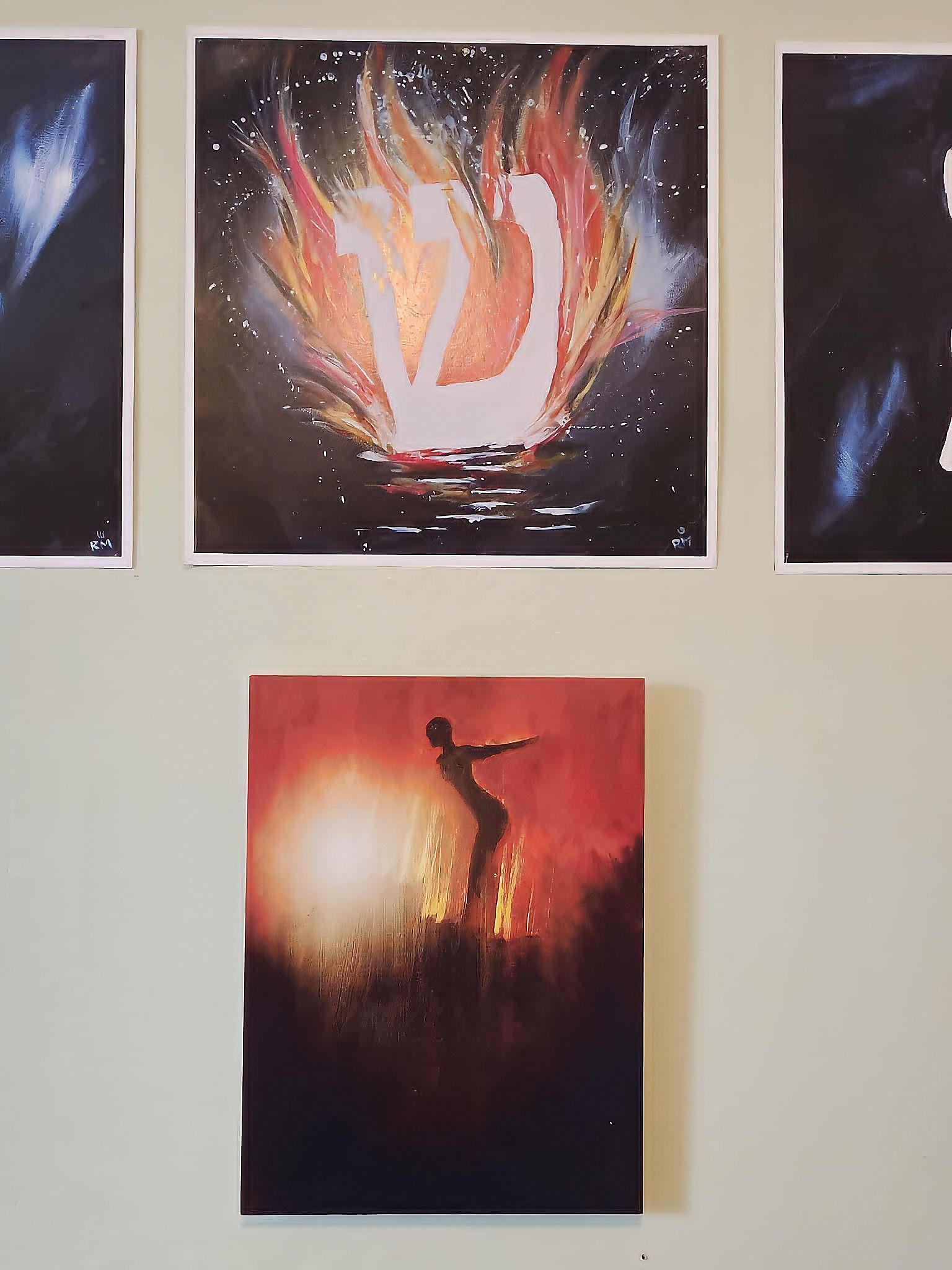 Collector installation of Faith series print beneath flaming Hebrew shin artwork in Niagara-on-the-Lake home