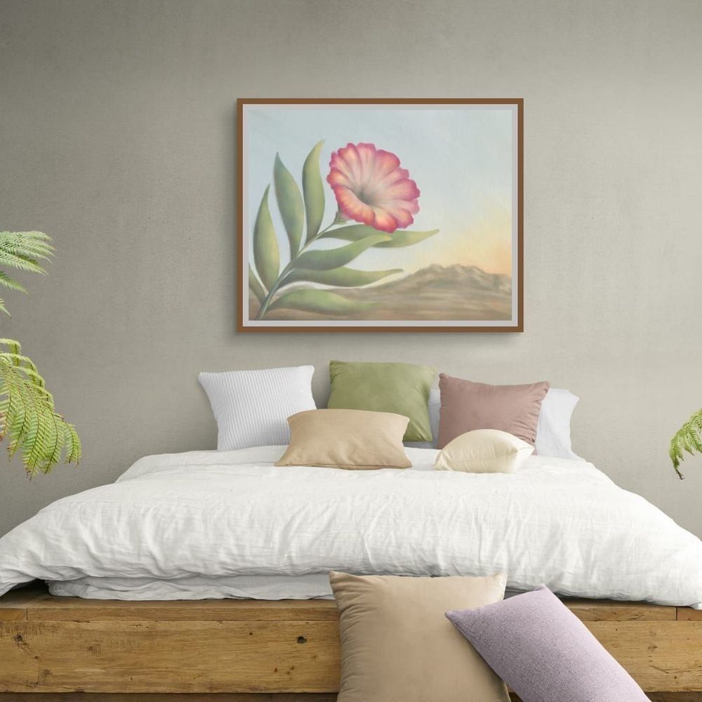 Soft Bell displayed with a wood frame above a bed.