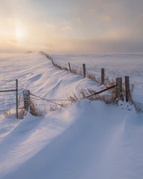 Old Rugged Fence In Drifting Snow