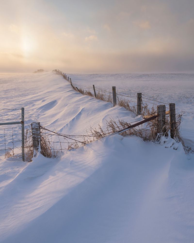 Old Rugged Fence In Drifting Snow